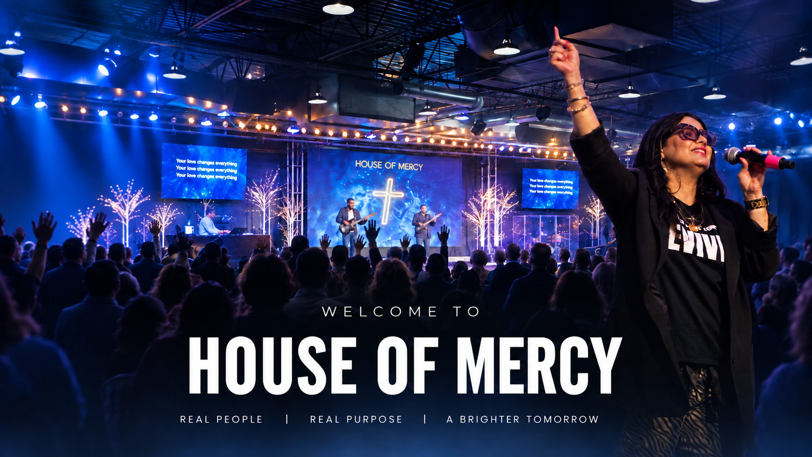 A worship singer in front of the Bethesda congregation and worship team. Welcome to House of Mercy. Real people. Real purpose. A brighter tomorrow.